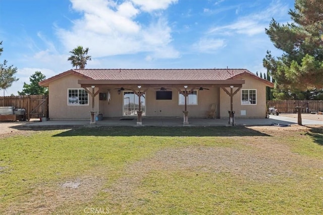 14296 Bieri St, Mojave, CA 93501 - rear view of property with ceiling fan, a tile roof, a patio, and stucco siding