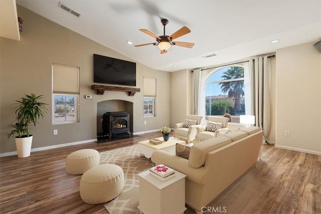 14296 Bieri St, Mojave, CA 93501 - living room with wood finished floors, a wood stove, a ceiling fan, lofted ceiling, and recessed lighting