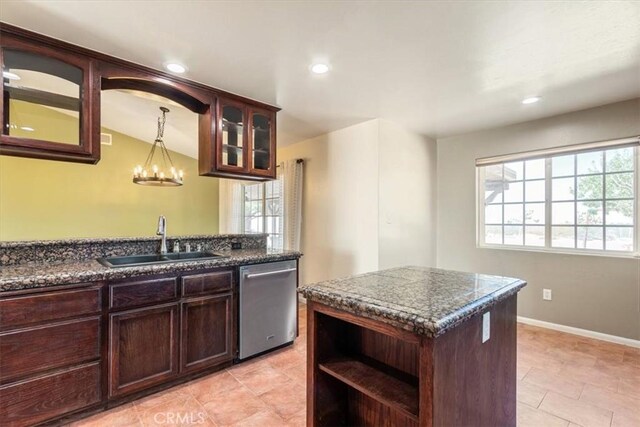 14296 Bieri St, Mojave, CA 93501 - kitchen with dishwasher, dark countertops, glass insert cabinets, recessed lighting, and dark brown cabinets