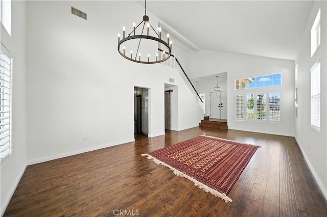 33175 Camino Maraca, Temecula, CA 92592 - unfurnished living room featuring a chandelier, high vaulted ceiling, and wood finished floors
