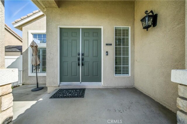 33175 Camino Maraca, Temecula, CA 92592 - entrance to property featuring stucco siding and a patio area