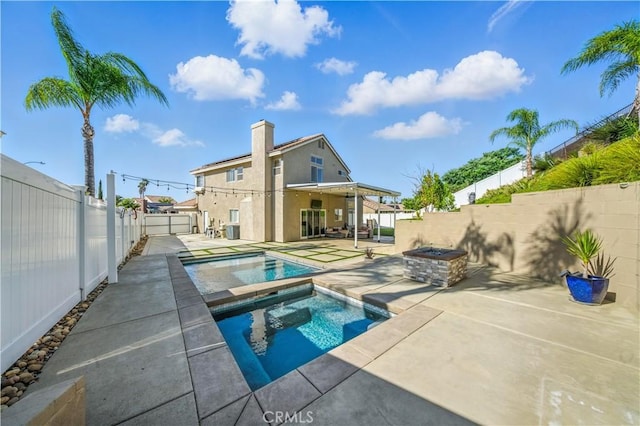 33175 Camino Maraca, Temecula, CA 92592 - view of swimming pool featuring an in-ground hot tub, a patio, and a fenced backyard