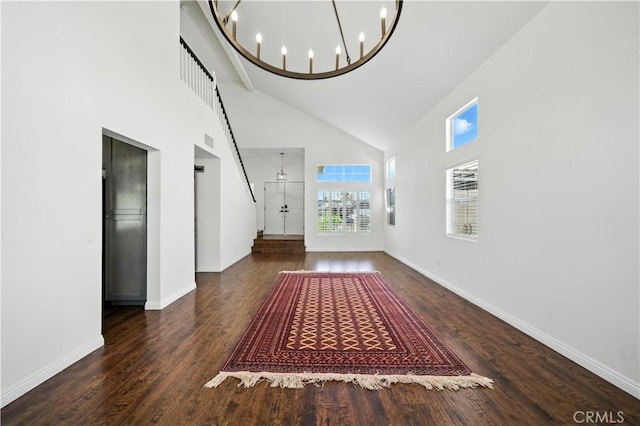 33175 Camino Maraca, Temecula, CA 92592 - unfurnished living room featuring high vaulted ceiling, wood finished floors, and a chandelier