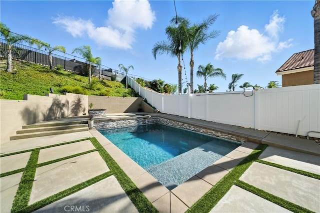 33175 Camino Maraca, Temecula, CA 92592 - view of pool featuring a fenced backyard, a patio area, and a pool with connected hot tub