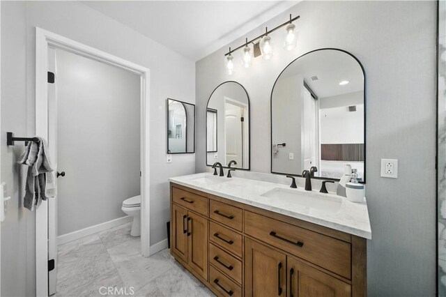 33175 Camino Maraca, Temecula, CA 92592 - bathroom featuring double vanity and marble look tile flooring