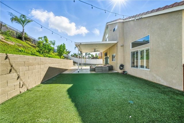 33175 Camino Maraca, Temecula, CA 92592 - fenced backyard featuring a ceiling fan, an outdoor hangout area, and a patio area