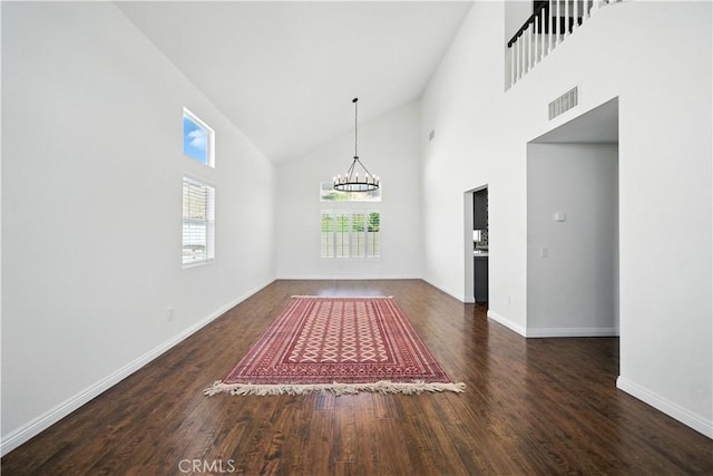 33175 Camino Maraca, Temecula, CA 92592 - unfurnished room with high vaulted ceiling, a chandelier, and wood finished floors
