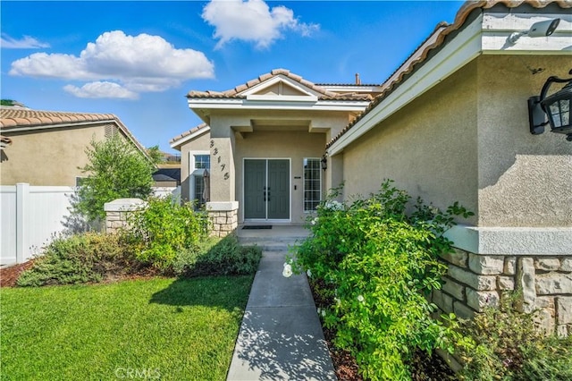 33175 Camino Maraca, Temecula, CA 92592 - entrance to property featuring stucco siding, a tiled roof, and stone siding