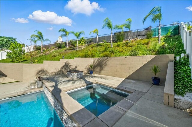 33175 Camino Maraca, Temecula, CA 92592 - view of swimming pool featuring a fenced backyard, a patio, and an in-ground hot tub