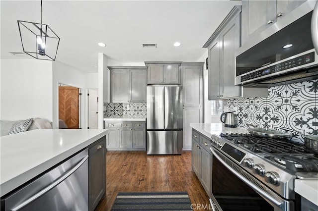 33175 Camino Maraca, Temecula, CA 92592 - kitchen featuring stainless steel appliances, gray cabinetry, light countertops, tasteful backsplash, and recessed lighting