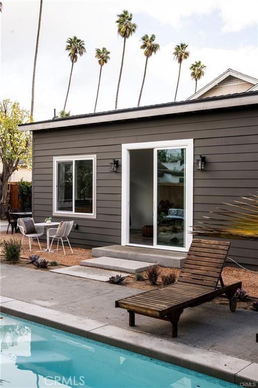 3702 Seneca Ave, Los Angeles, CA 90039 - back of house featuring a patio area and an outdoor pool