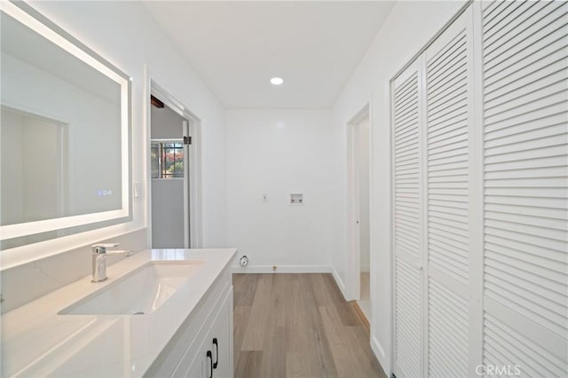 3704 Lorado Way, View Park, CA 90043 - bathroom featuring a closet, vanity, wood finished floors, and recessed lighting