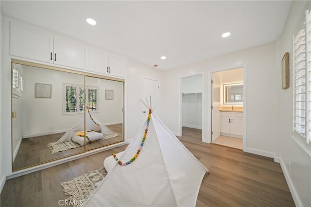 3704 Lorado Way, View Park, CA 90043 - corridor with wood finished floors, healthy amount of natural light, and recessed lighting