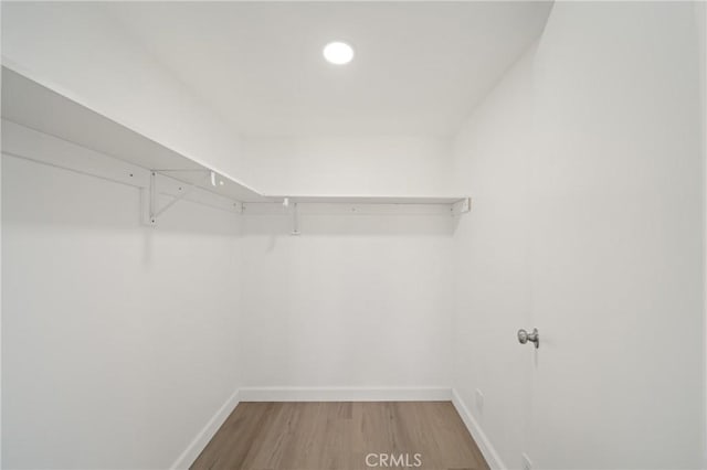 3704 Lorado Way, View Park, CA 90043 - walk in closet featuring light wood-type flooring