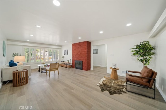 3704 Lorado Way, View Park, CA 90043 - living area featuring light wood finished floors, a fireplace, and recessed lighting