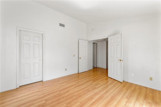 44051 Sheldon Ct, Temecula, CA 92592 - unfurnished bedroom featuring light wood-style flooring and lofted ceiling