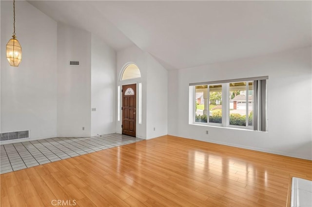 44051 Sheldon Ct, Temecula, CA 92592 - foyer featuring wood finished floors, high vaulted ceiling, and a chandelier