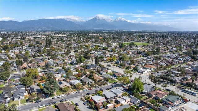 573 E Alvarado St, Pomona, CA 91767 - aerial overview of property's location featuring mountains and nearby suburban area