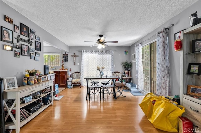 2660 Newell St, County Los Angeles, CA 90039 - dining room with a textured ceiling, a ceiling fan, and light wood-type flooring