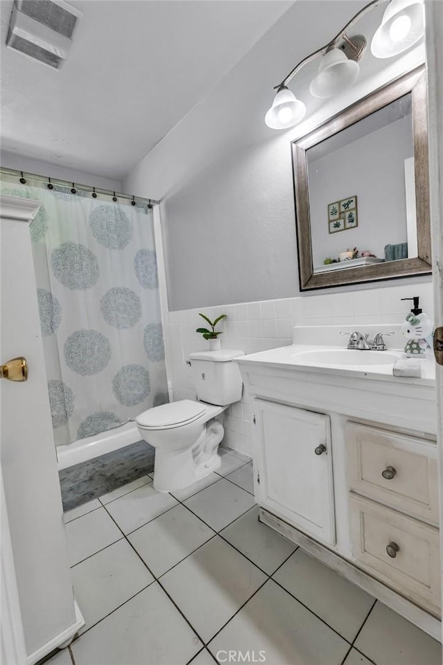 2660 Newell St, County Los Angeles, CA 90039 - full bathroom featuring vanity, a shower with curtain, tile patterned flooring, and tile walls