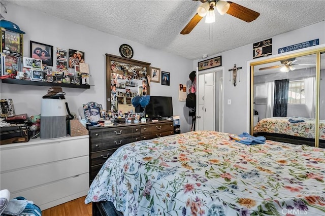 2660 Newell St, County Los Angeles, CA 90039 - bedroom featuring a textured ceiling, wood finished floors, and a ceiling fan