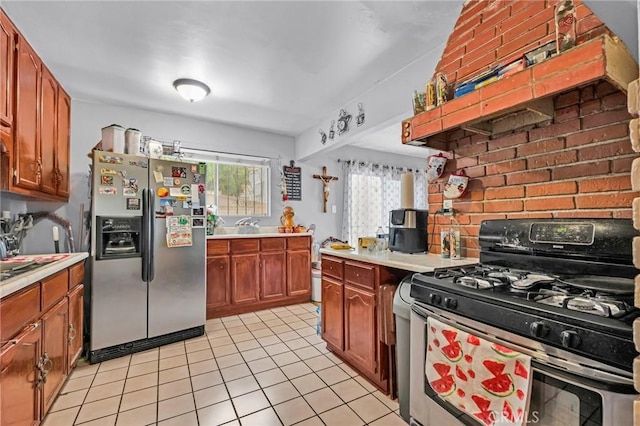 2660 Newell St, County Los Angeles, CA 90039 - kitchen with stainless steel appliances, light countertops, light tile patterned floors, and brown cabinetry