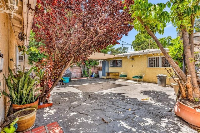 2660 Newell St, County Los Angeles, CA 90039 - rear view of house with stucco siding and a patio area