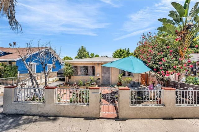2660 Newell St, County Los Angeles, CA 90039 - view of front of house with a fenced front yard, stucco siding, and a gate