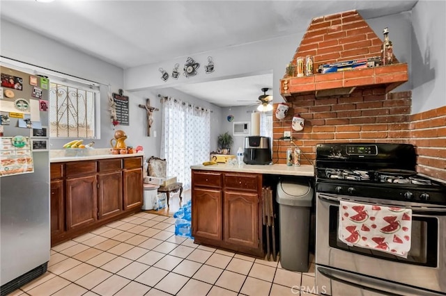 2660 Newell St, County Los Angeles, CA 90039 - kitchen featuring appliances with stainless steel finishes, light countertops, light tile patterned floors, and ceiling fan