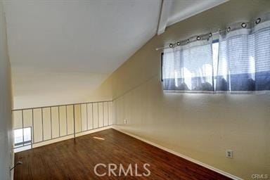 16857 San Fernando Mission Blvd Unit 7, Granada Hills, CA 91344 - additional living space featuring vaulted ceiling, plenty of natural light, and wood finished floors