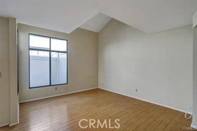 16857 San Fernando Mission Blvd Unit 7, Granada Hills, CA 91344 - spare room with wood finished floors and vaulted ceiling