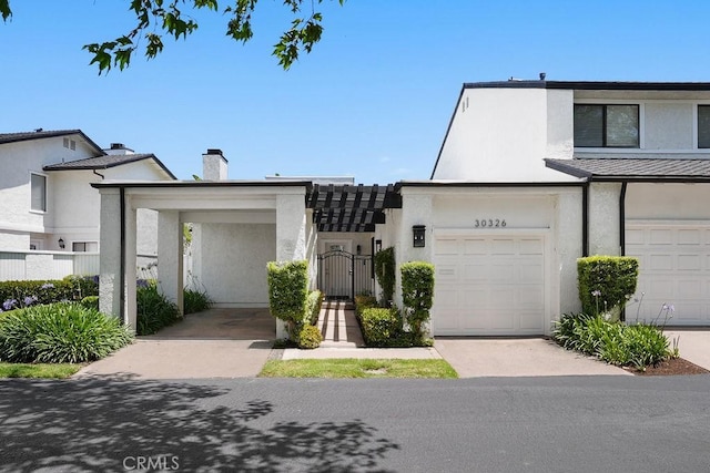 30326 Via Reata, Laguna Niguel, CA 92677 - multi unit property with stucco siding, a chimney, a gate, and a garage