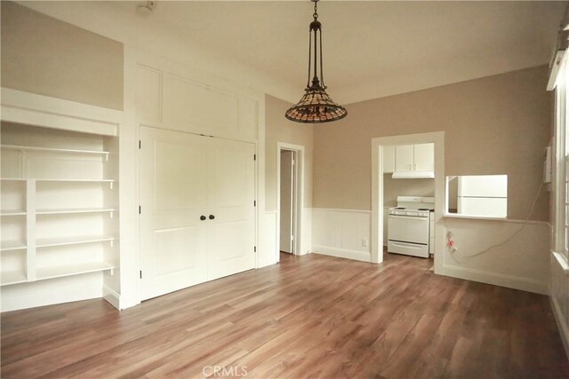 604 Salem St, Chico, CA 95928 - unfurnished dining area featuring wood finished floors and wainscoting