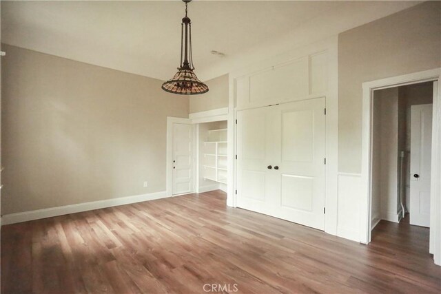 604 Salem St, Chico, CA 95928 - unfurnished bedroom featuring wood finished floors and a closet