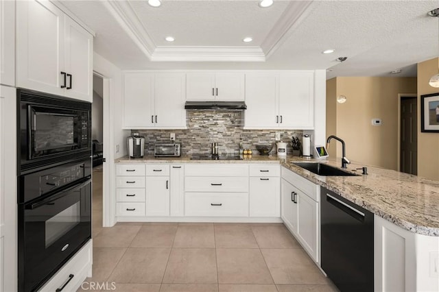 24330 Via Arriba Linda, Yorba Linda, CA 92887 - kitchen with black appliances, a peninsula, under cabinet range hood, backsplash, and white cabinets