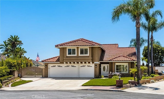 24330 Via Arriba Linda, Yorba Linda, CA 92887 - mediterranean / spanish-style home with a tiled roof, stucco siding, driveway, and a gate