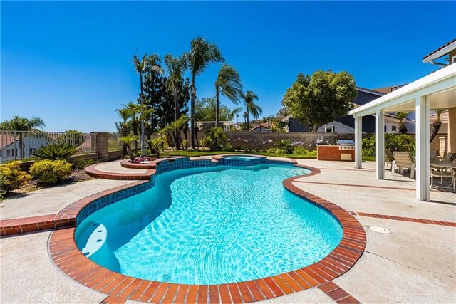 24330 Via Arriba Linda, Yorba Linda, CA 92887 - view of pool with a fenced backyard, a patio area, an outdoor kitchen, and a pool with connected hot tub