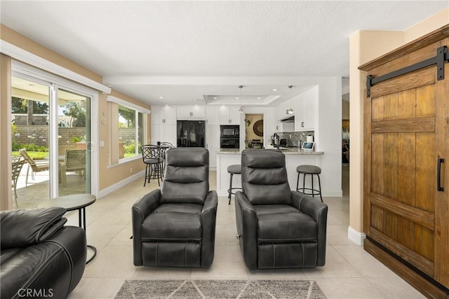 24330 Via Arriba Linda, Yorba Linda, CA 92887 - living area featuring a barn door, light tile patterned flooring, and a textured ceiling