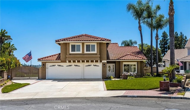 24330 Via Arriba Linda, Yorba Linda, CA 92887 - view of front of house featuring a tile roof, driveway, stucco siding, an attached garage, and a gate