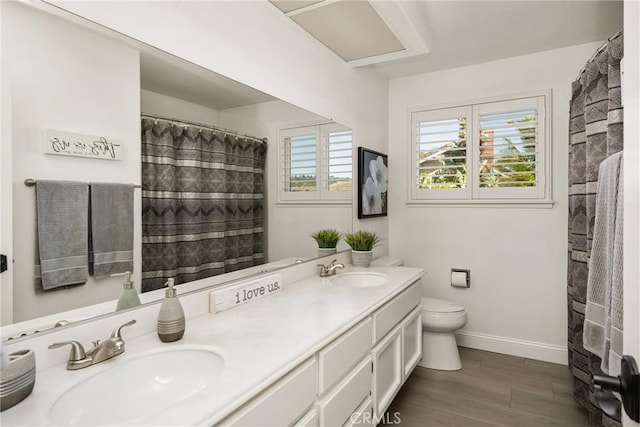 24330 Via Arriba Linda, Yorba Linda, CA 92887 - bathroom featuring double vanity, wood finished floors, and a shower with shower curtain