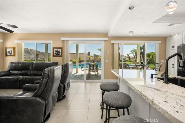 24330 Via Arriba Linda, Yorba Linda, CA 92887 - living room with light tile patterned floors, ceiling fan, recessed lighting, and a textured ceiling