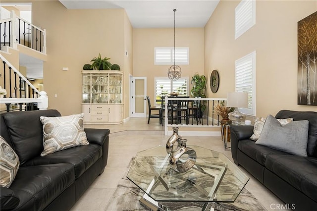 24330 Via Arriba Linda, Yorba Linda, CA 92887 - living area featuring a towering ceiling, stairs, a chandelier, and tile patterned flooring