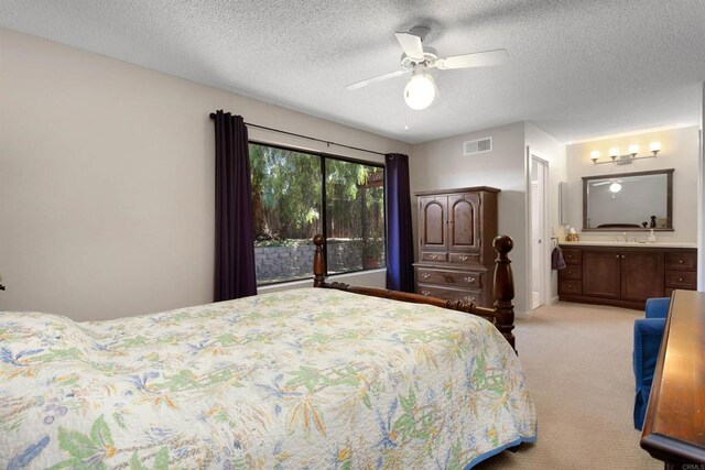468 Las Brisas Dr, Escondido, CA 92027 - bedroom featuring light colored carpet, a textured ceiling, ensuite bath, and a ceiling fan