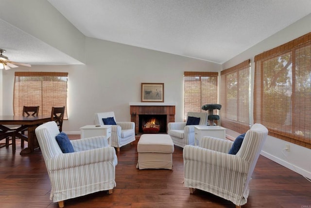 468 Las Brisas Dr, Escondido, CA 92027 - living room featuring lofted ceiling, ceiling fan, a brick fireplace, a textured ceiling, and wood finished floors