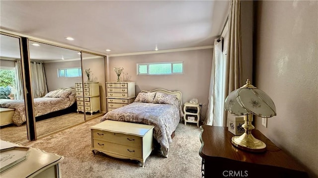 3001 Via Buena Vis Unit C, Laguna Woods, CA 92637 - bedroom featuring ornamental molding, light carpet, multiple windows, a closet, and recessed lighting