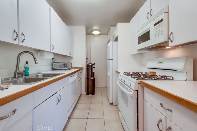 18350 Hatteras St Unit 263, Tarzana, CA 91356 - kitchen with white appliances, light countertops, and white cabinets