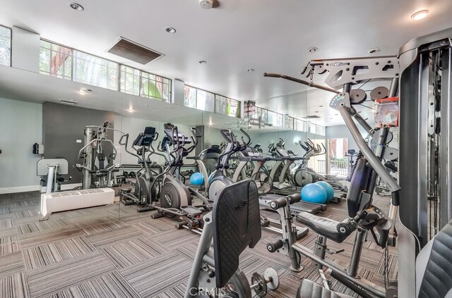 18350 Hatteras St Unit 263, Tarzana, CA 91356 - workout area featuring plenty of natural light, carpet flooring, a high ceiling, and recessed lighting