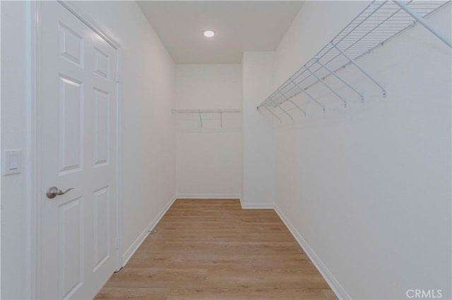 24679 Acadia Dr, Corona, CA 92883 - spacious closet featuring light wood-type flooring