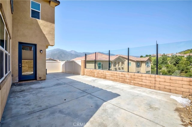 24679 Acadia Dr, Corona, CA 92883 - fenced backyard with a patio area and a mountain view