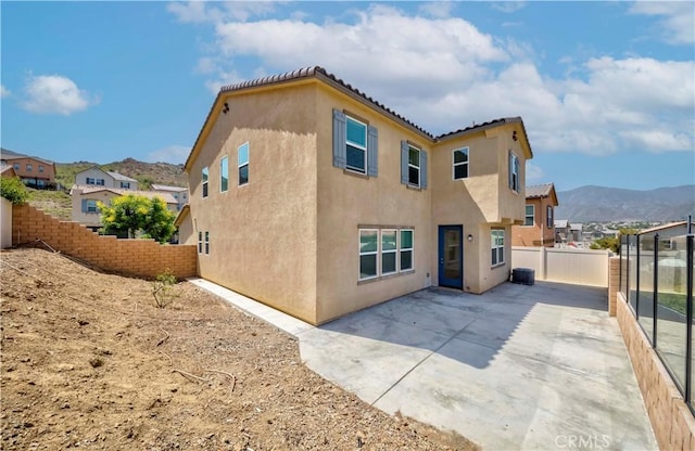 24679 Acadia Dr, Corona, CA 92883 - rear view of property with stucco siding, a patio, a mountain view, and a residential view